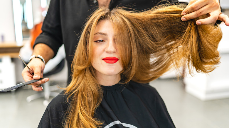 Woman with long layered haircut 