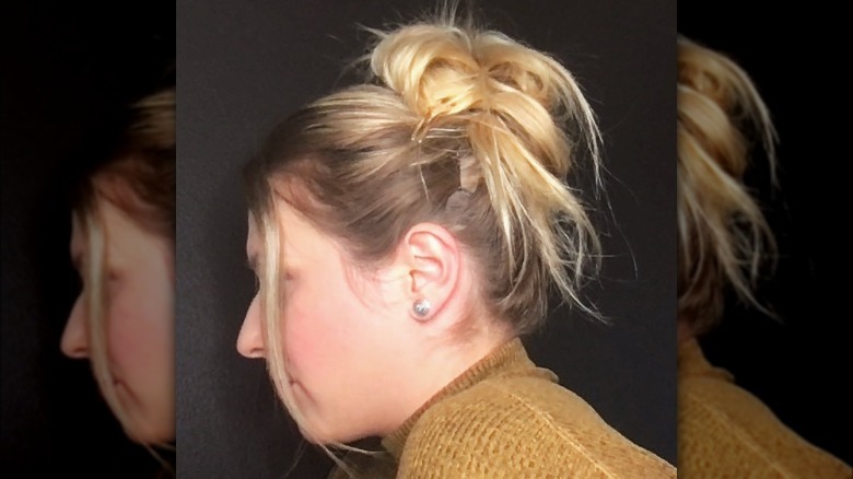 Woman wearing a messy bun