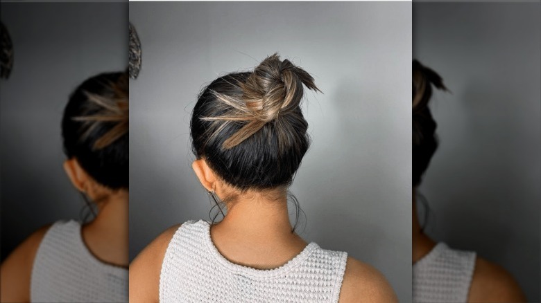 Girl wearing a spiky bun