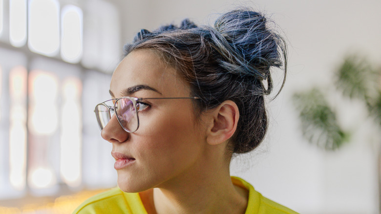 woman wearing messy bun