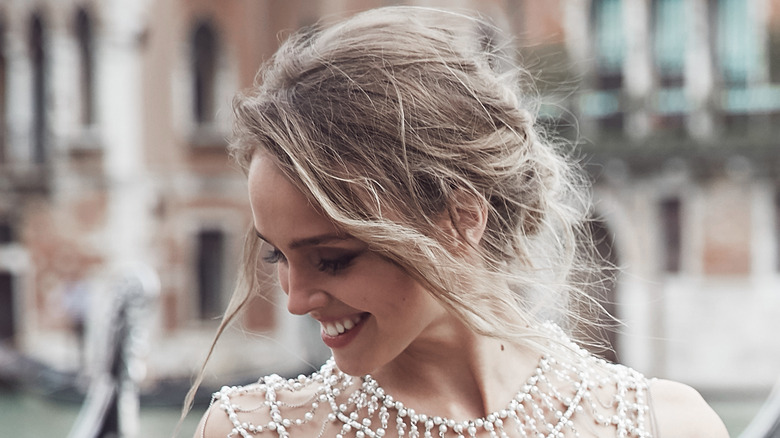 woman wearing messy wedding updo