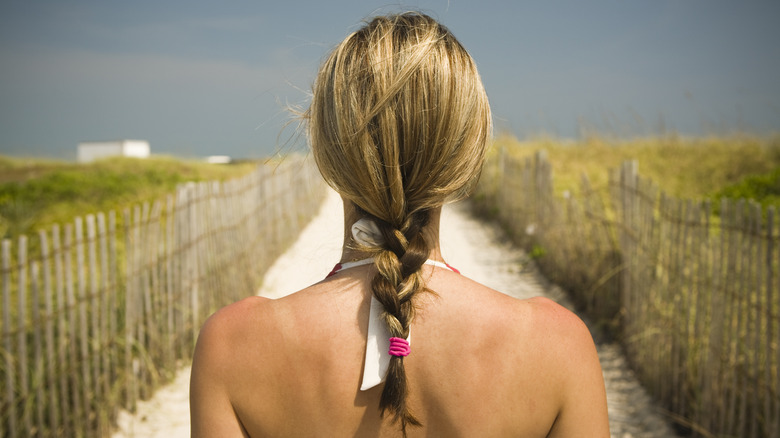 Woman on the beach with braid