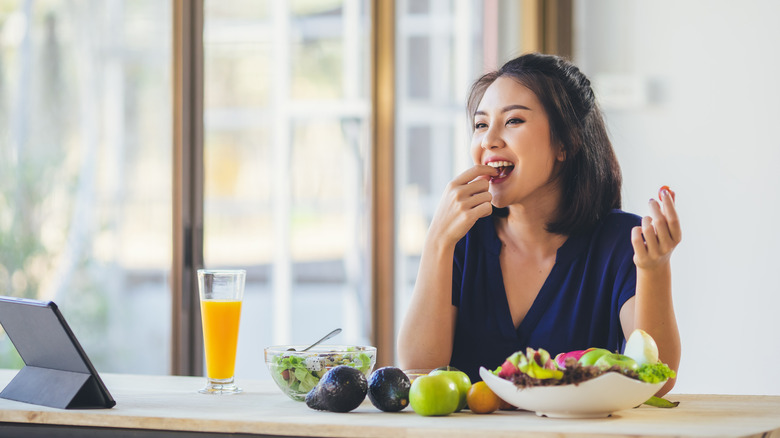 Woman eats well balanced lunch