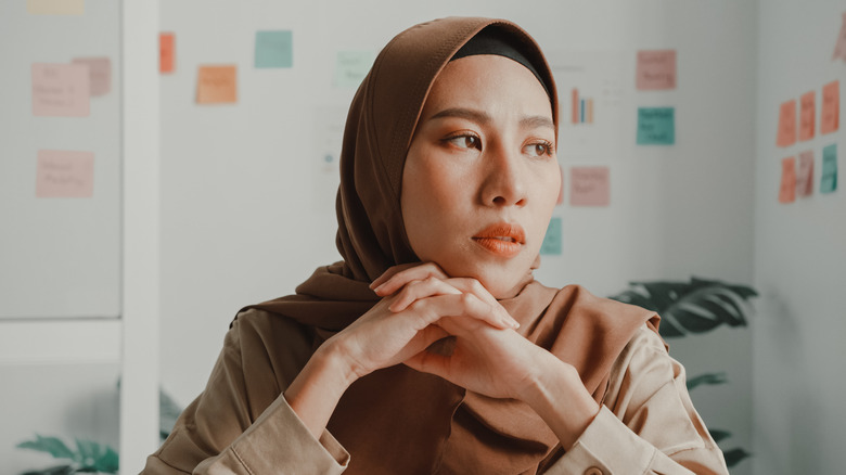 sad woman sitting at desk