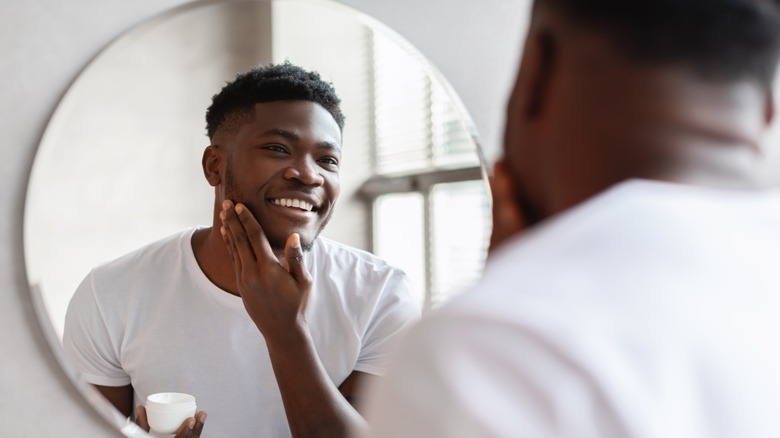 African American man looking in the mirror