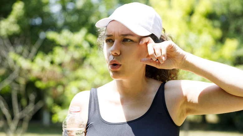 Woman wearing cap while exercising outdoors