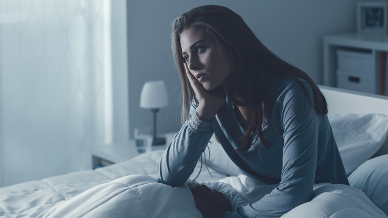 Woman awake in bed