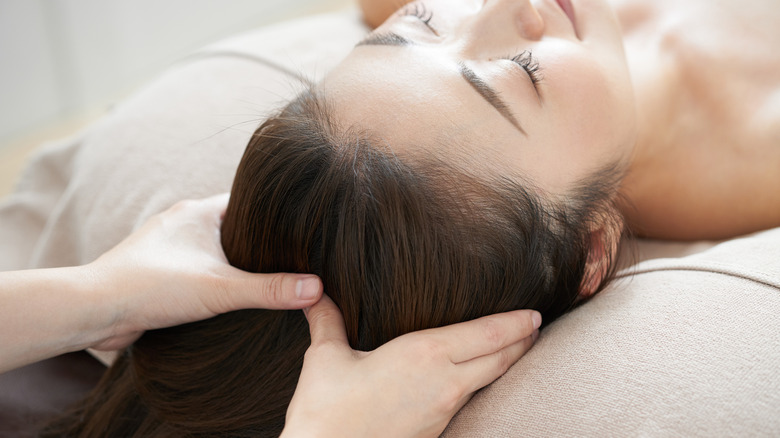 person receiving head spa massage