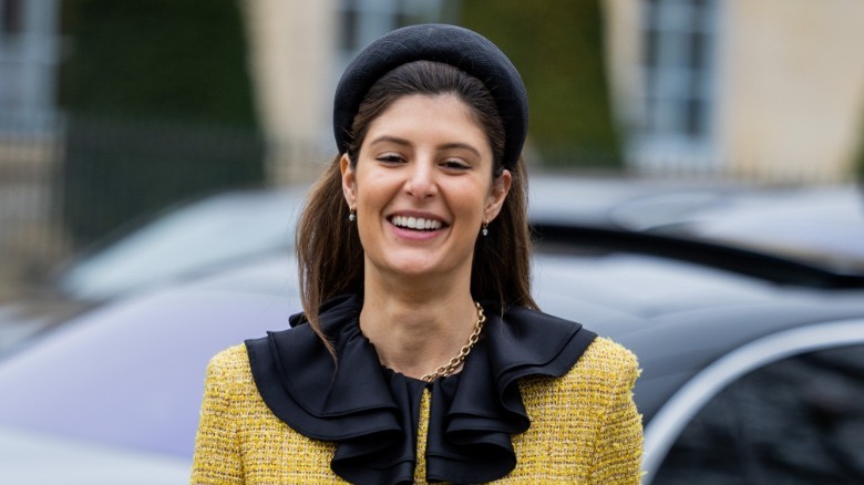 woman wearing black headband and dress