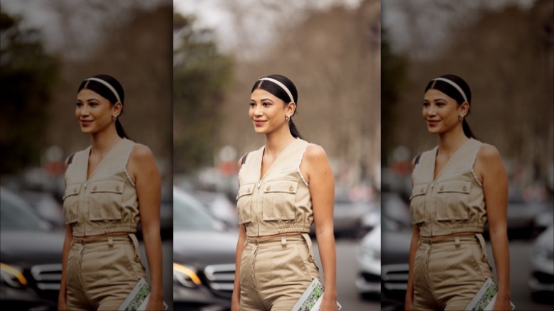 woman wearing beige jumpsuit and headband