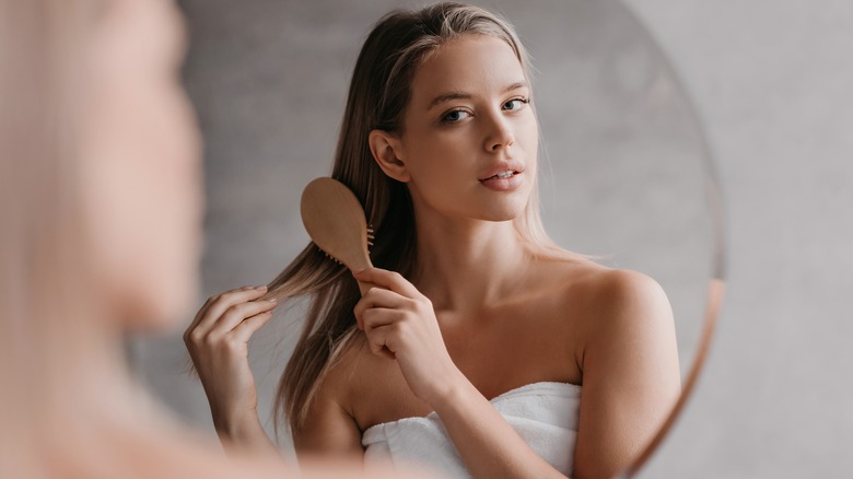 woman brushing washed hair