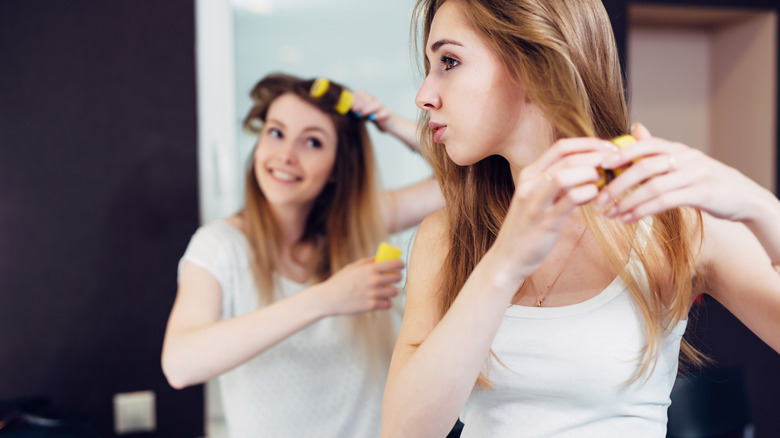 Women with velcro rollers in hair