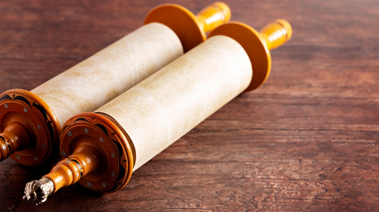 Torah scroll on wooden surface