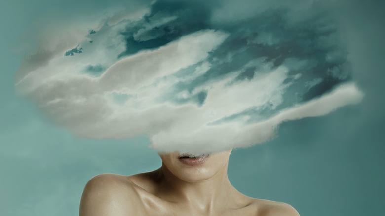 Woman's head hidden by cloud