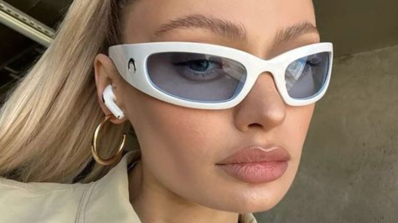 Instagram model wearing white shades