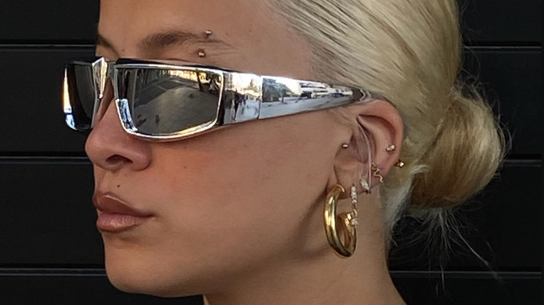 blonde model wearing chrome shades