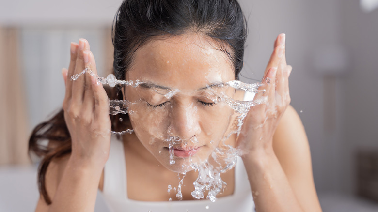 Woman washing face