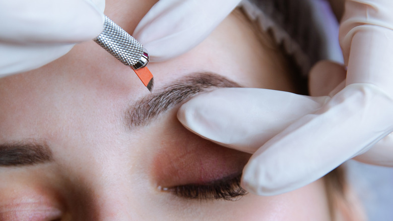 woman getting semi-permanent eyebrows