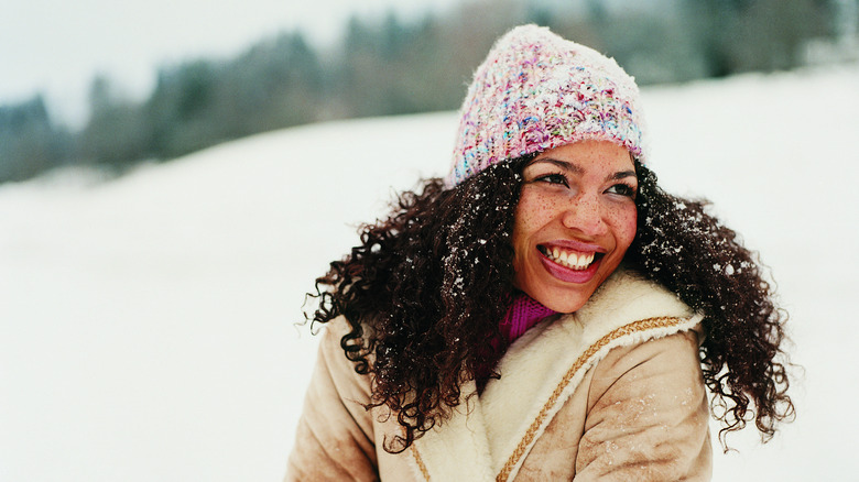 young woman enjoying the snow