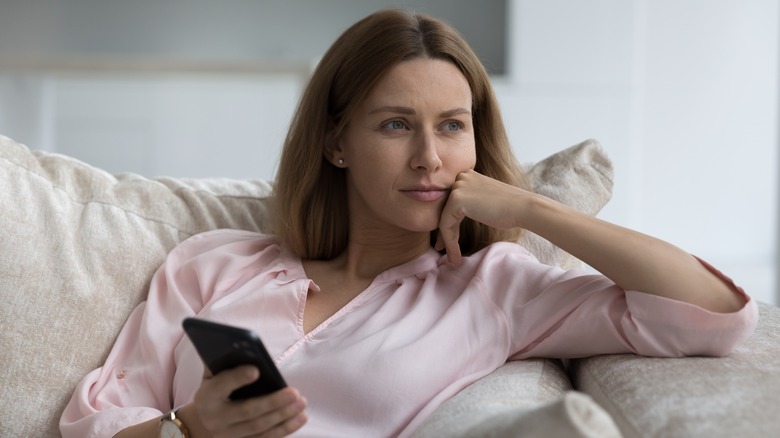 woman waiting on couch