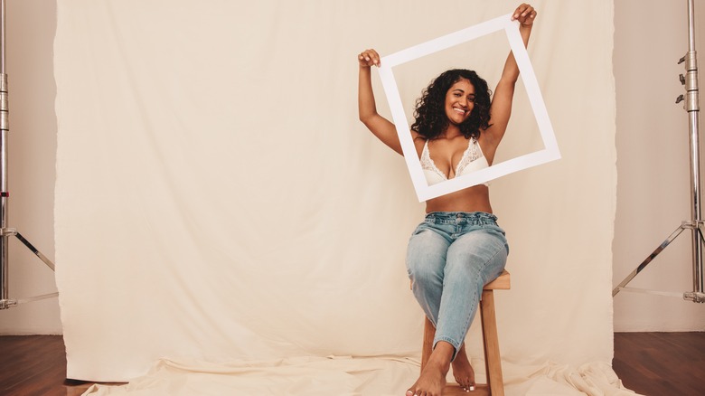 Woman in jeans and bra