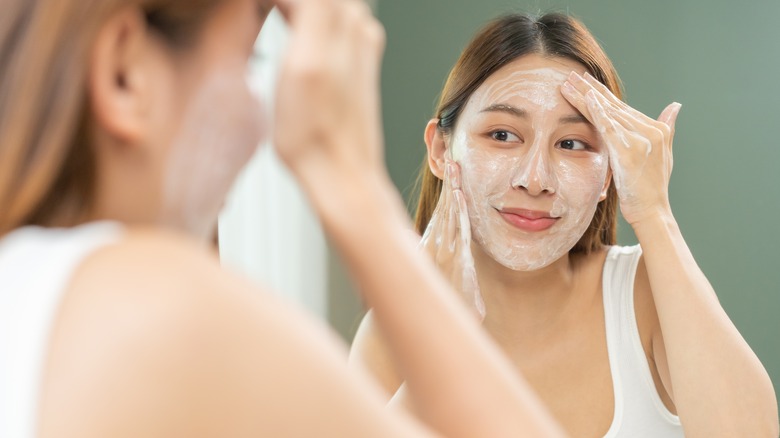 Woman using exfoliating scrub