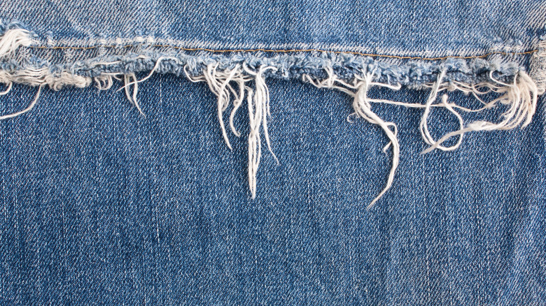 close up of frayed jeans