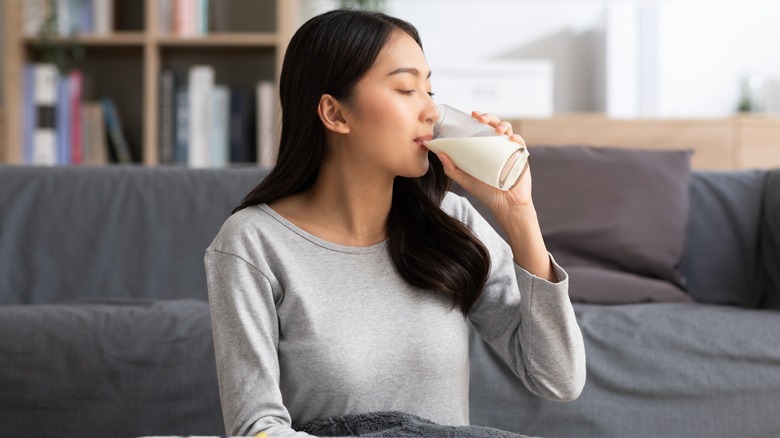 woman drinking glass of milk