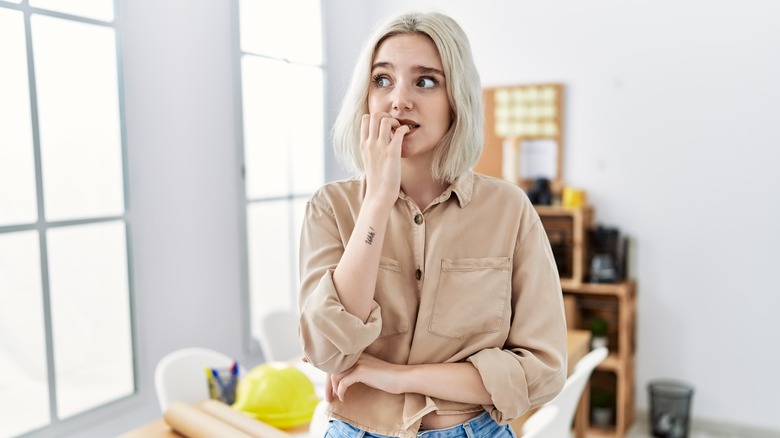 woman biting nails