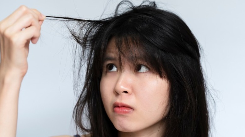 Woman looking up at bangs