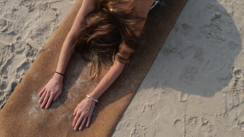 woman using natural yoga mat