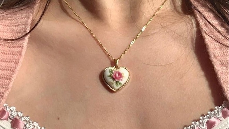 person wearing a heart locket