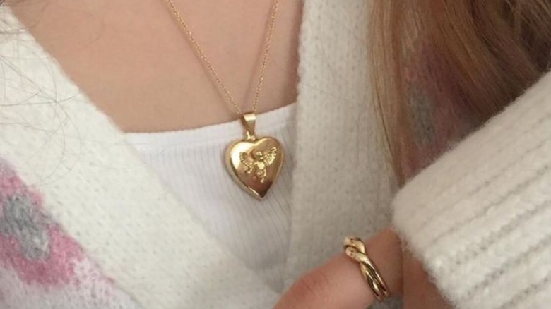 person wearing a heart locket