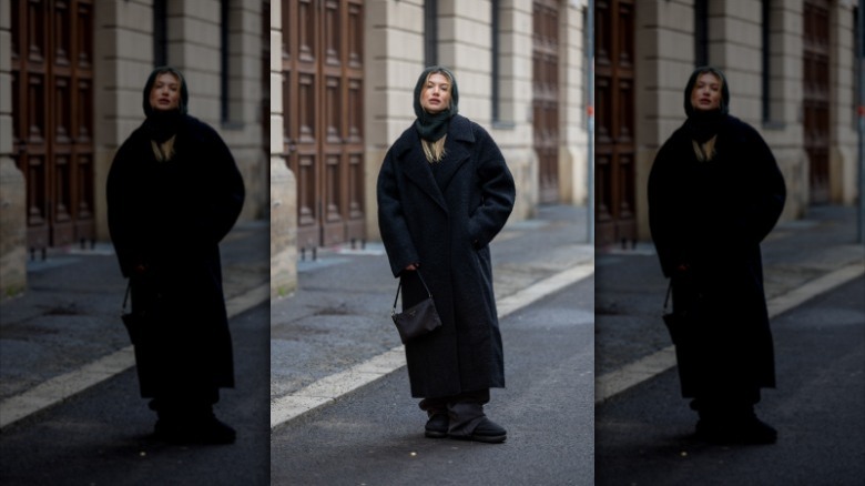 woman wearing black oversized coat 