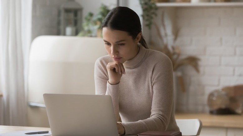 Woman studying at laptop