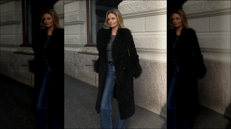 black coat with straight-leg jeans