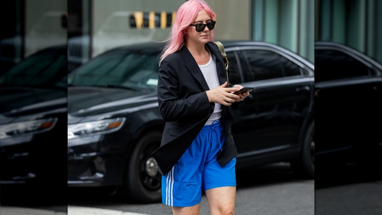 Woman wearing blue athletic shorts