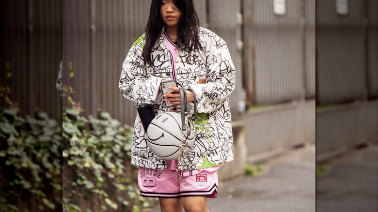 Woman wearing pink basketball shorts