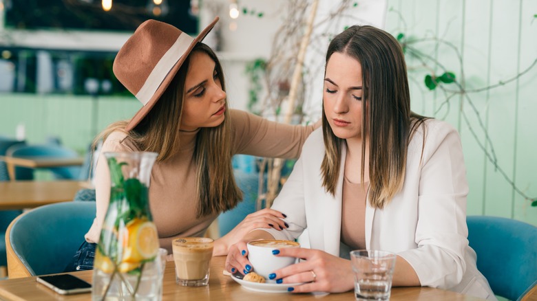 woman talking to sad friend