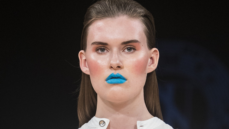 Model wearing sky blue lipstick
