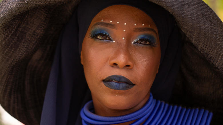 Woman with blue cosmetics