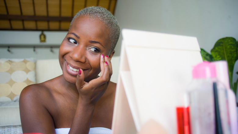 Woman applying makeup