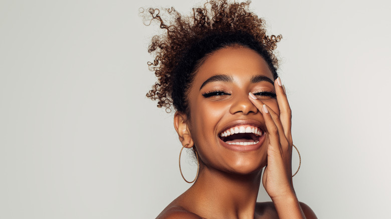 Smiling woman with healthy skin