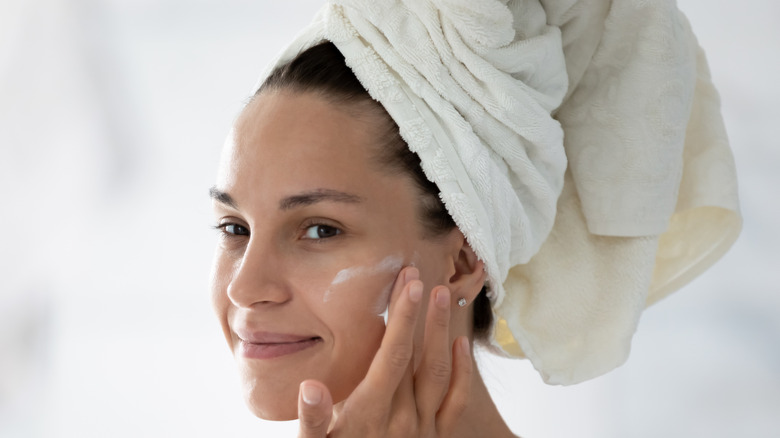 woman moisturizing after shower