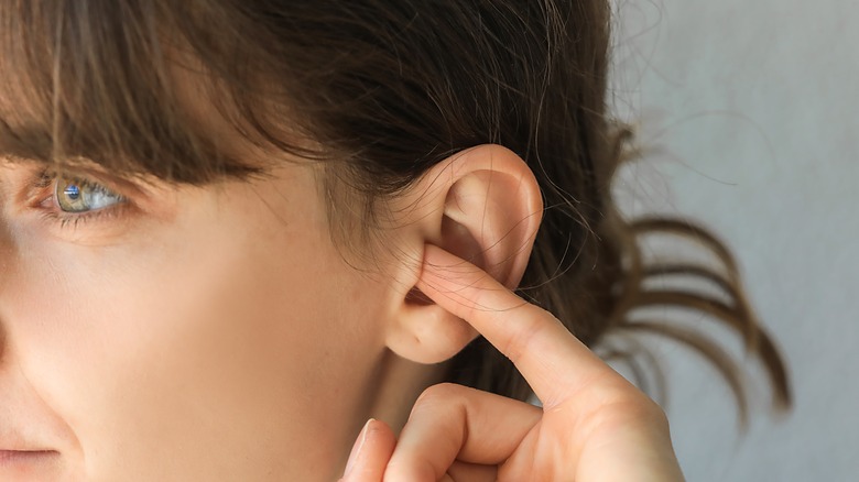 earwax in a dirty ear of a child