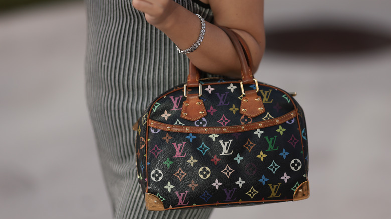 woman with Louis Vuitton bag