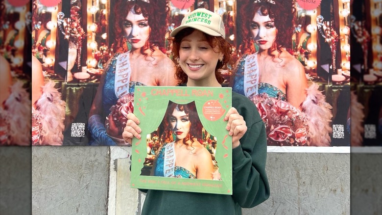 Chappell Roan posing with vinyl album