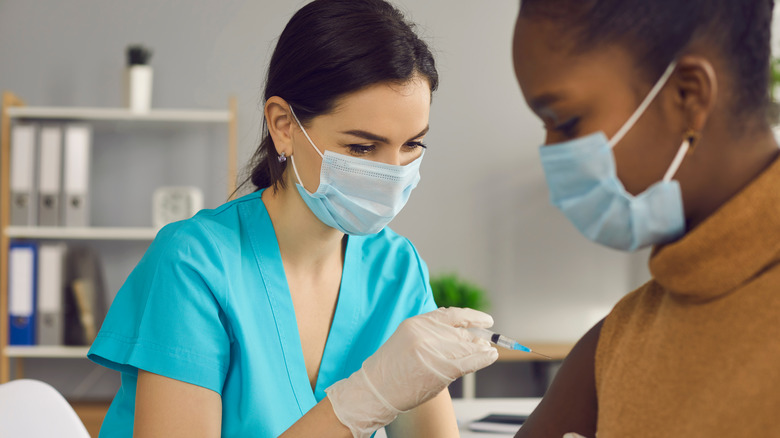 woman getting vaccinated