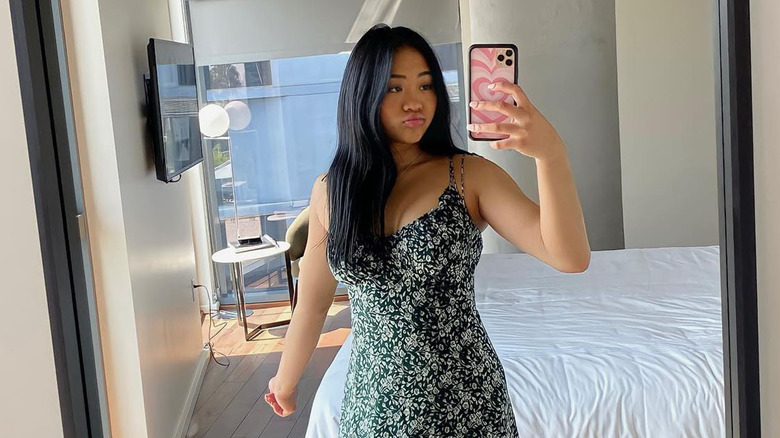 Suni Lee green floral dress selfie