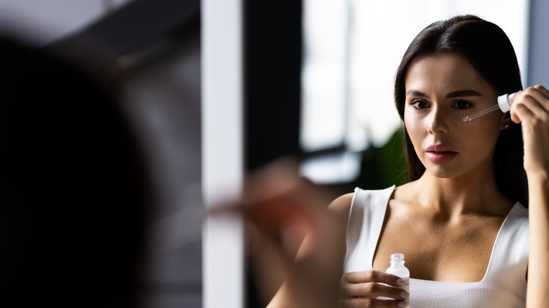 woman applying niacinamide